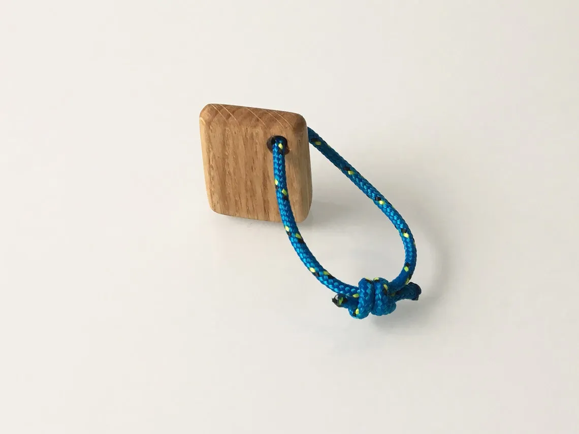 Oak anchor keyring held in an open palm to show its small size