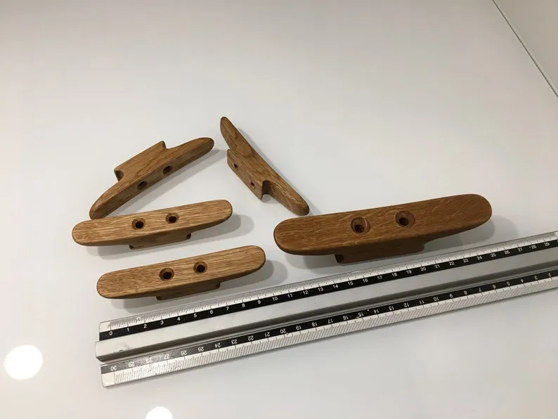 Angled view showing the two mounting holes drilled through the cleat base