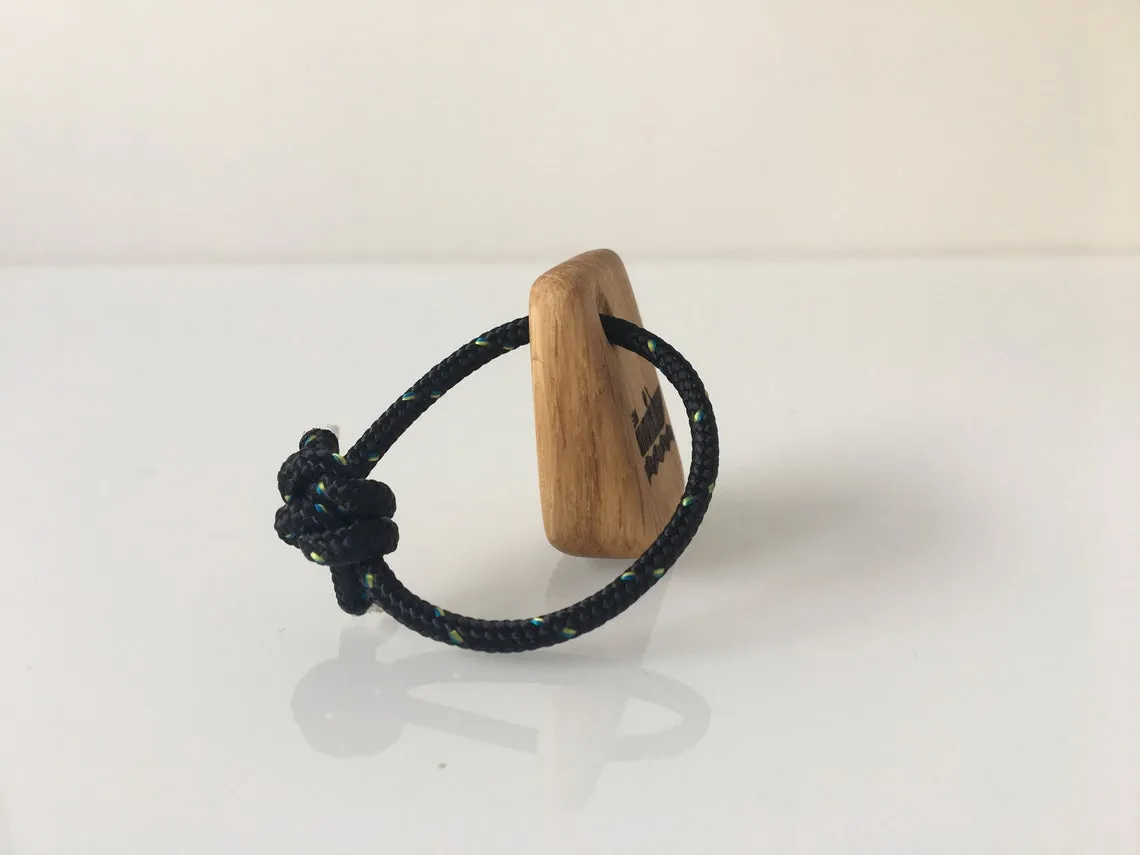 Blue yacht rope loop threaded through the wooden keyring