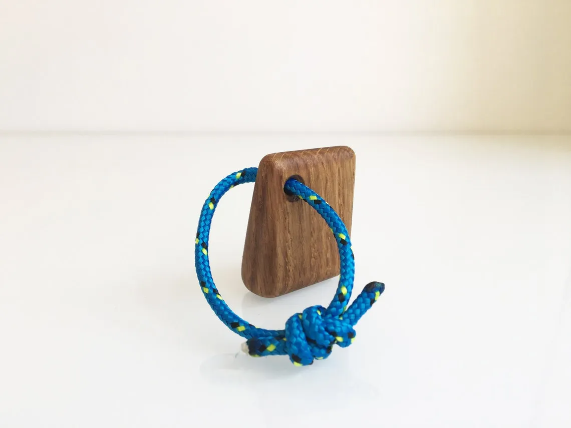 Red yacht rope loop knotted through the oak keychain