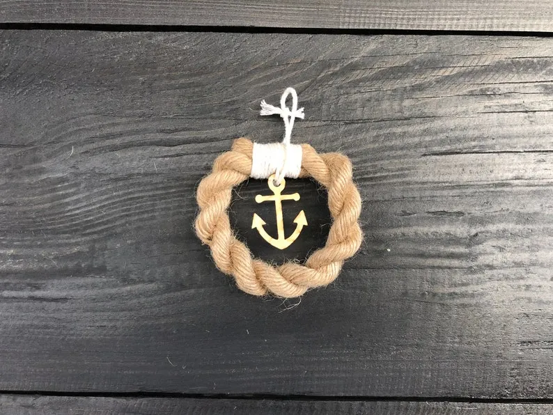 Small jute rope ornament, roughly 7cm wide, resting on linen