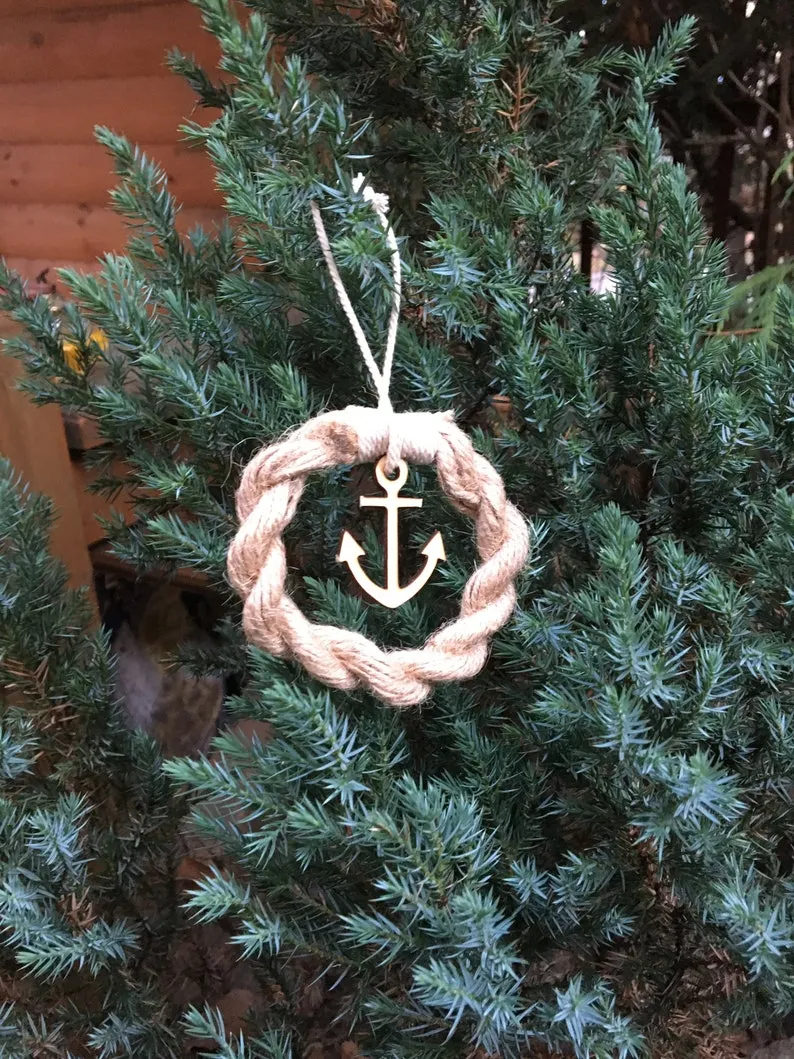 Ornament tied with twine and hung on a Christmas tree branch