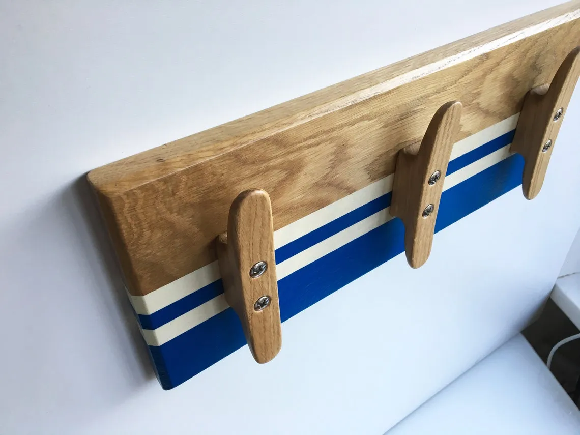 The coat rack lying on a workbench beside chisels and shavings