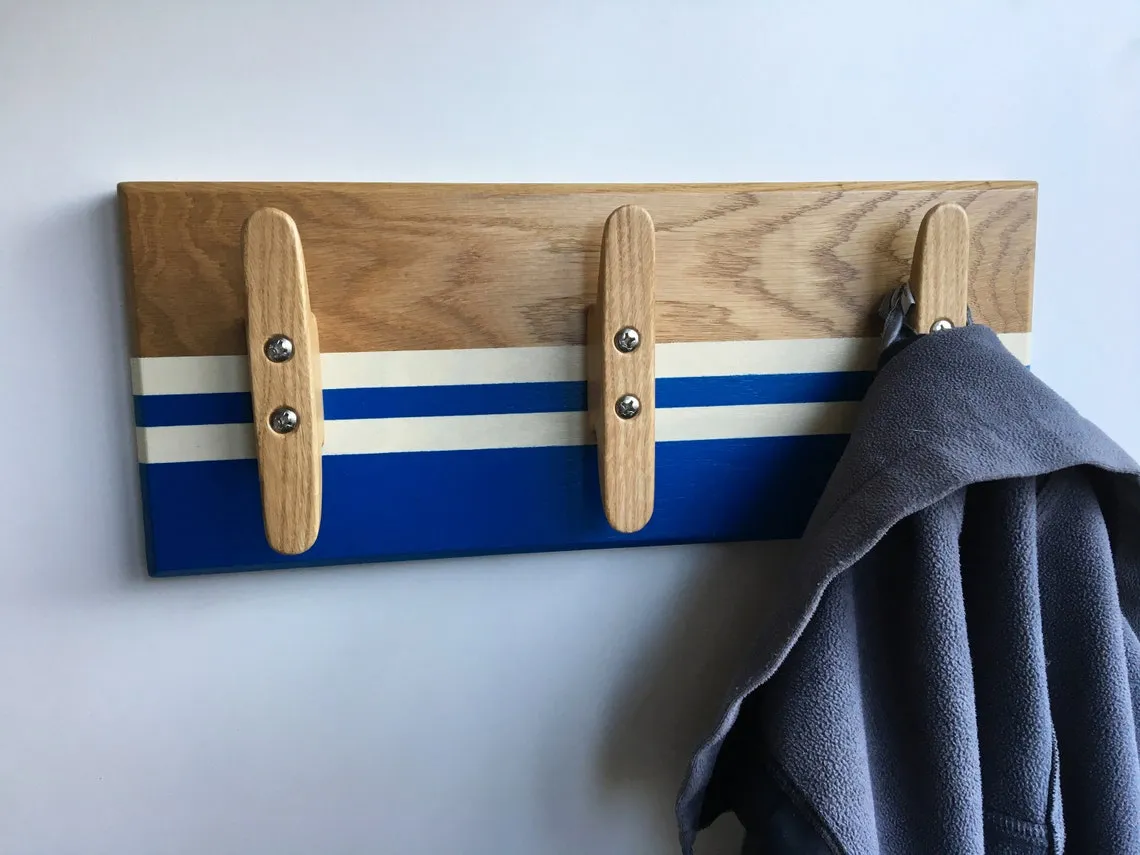 Towel hanging from the middle cleat in a bathroom