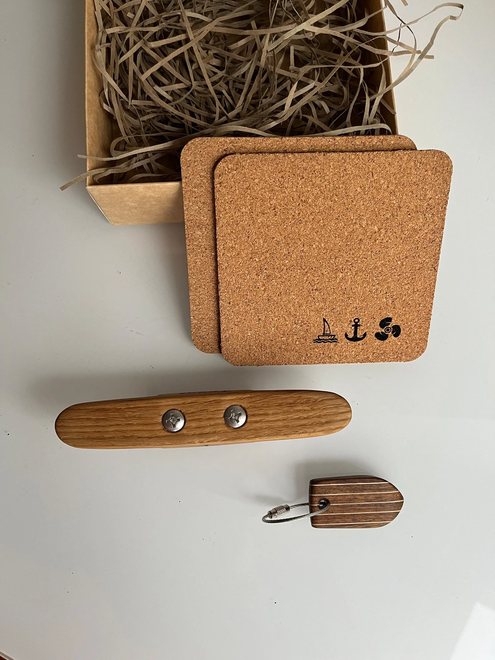 Personalised oak bottle opener lying in the box lining