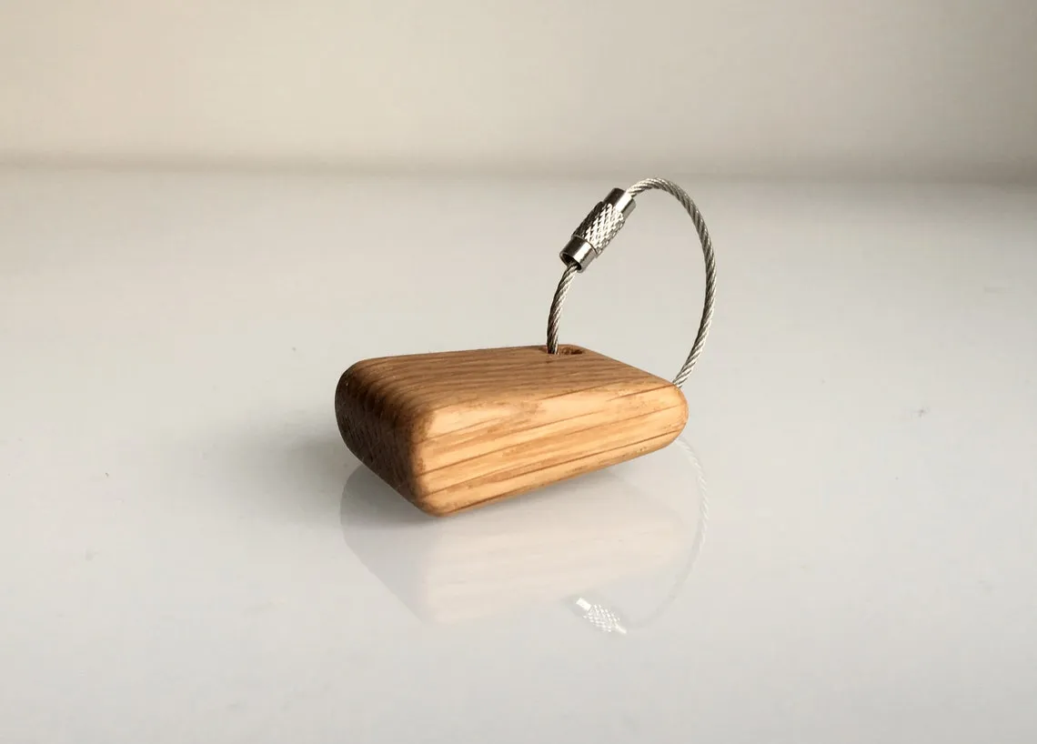 Stainless steel wire loop version resting on oak boards