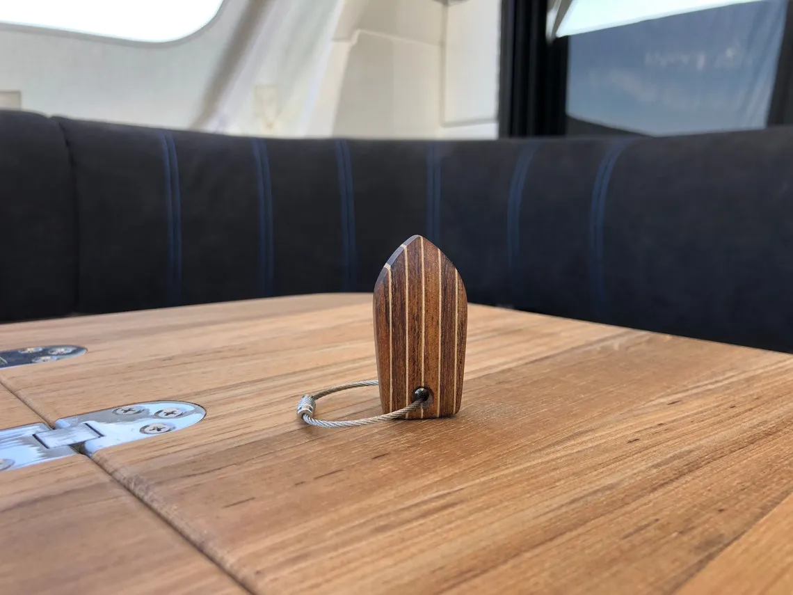 Three keychains lined up, showing slight grain variations