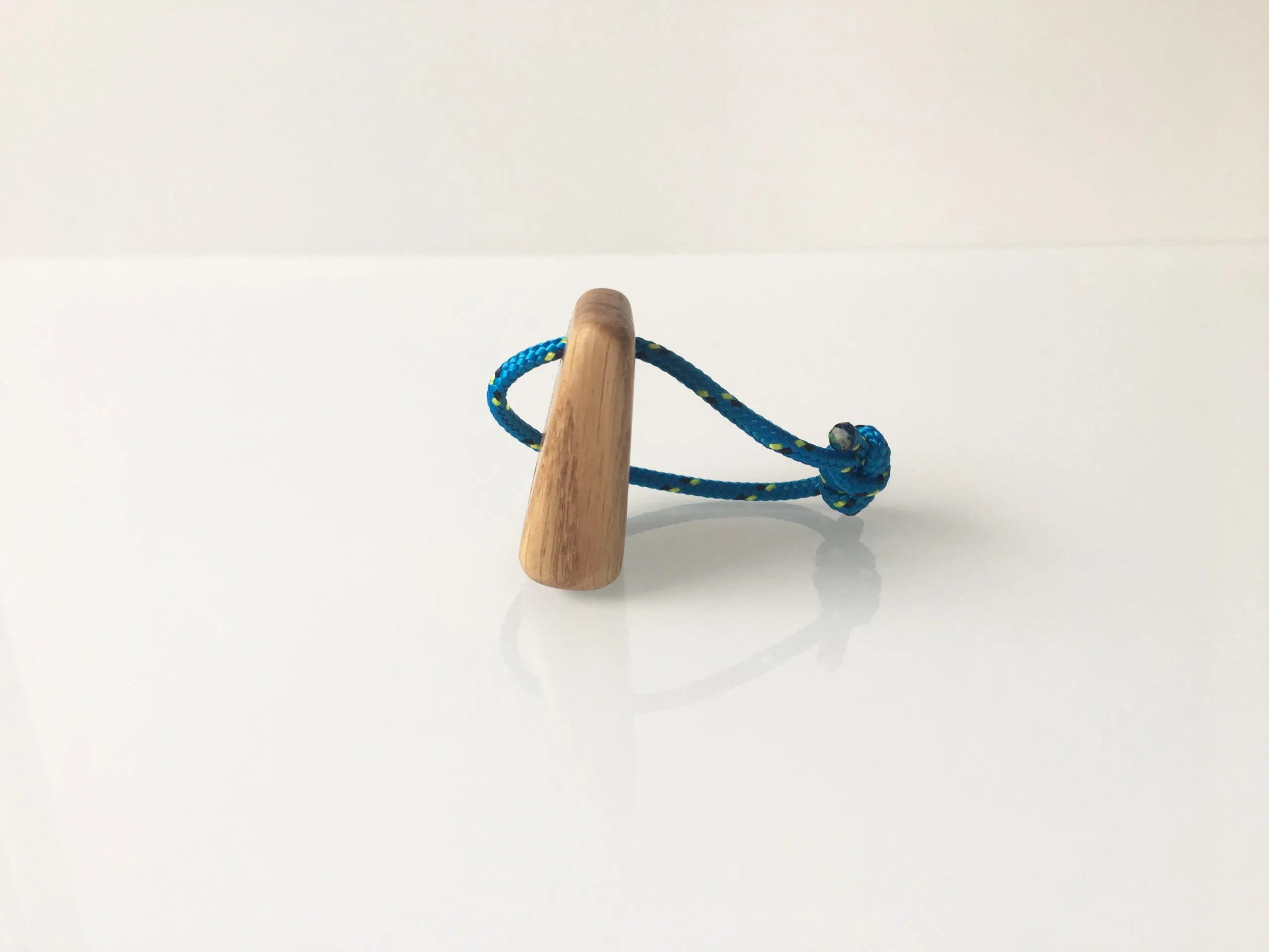 Stainless steel rope loop and crimped fitting on the oak keychain