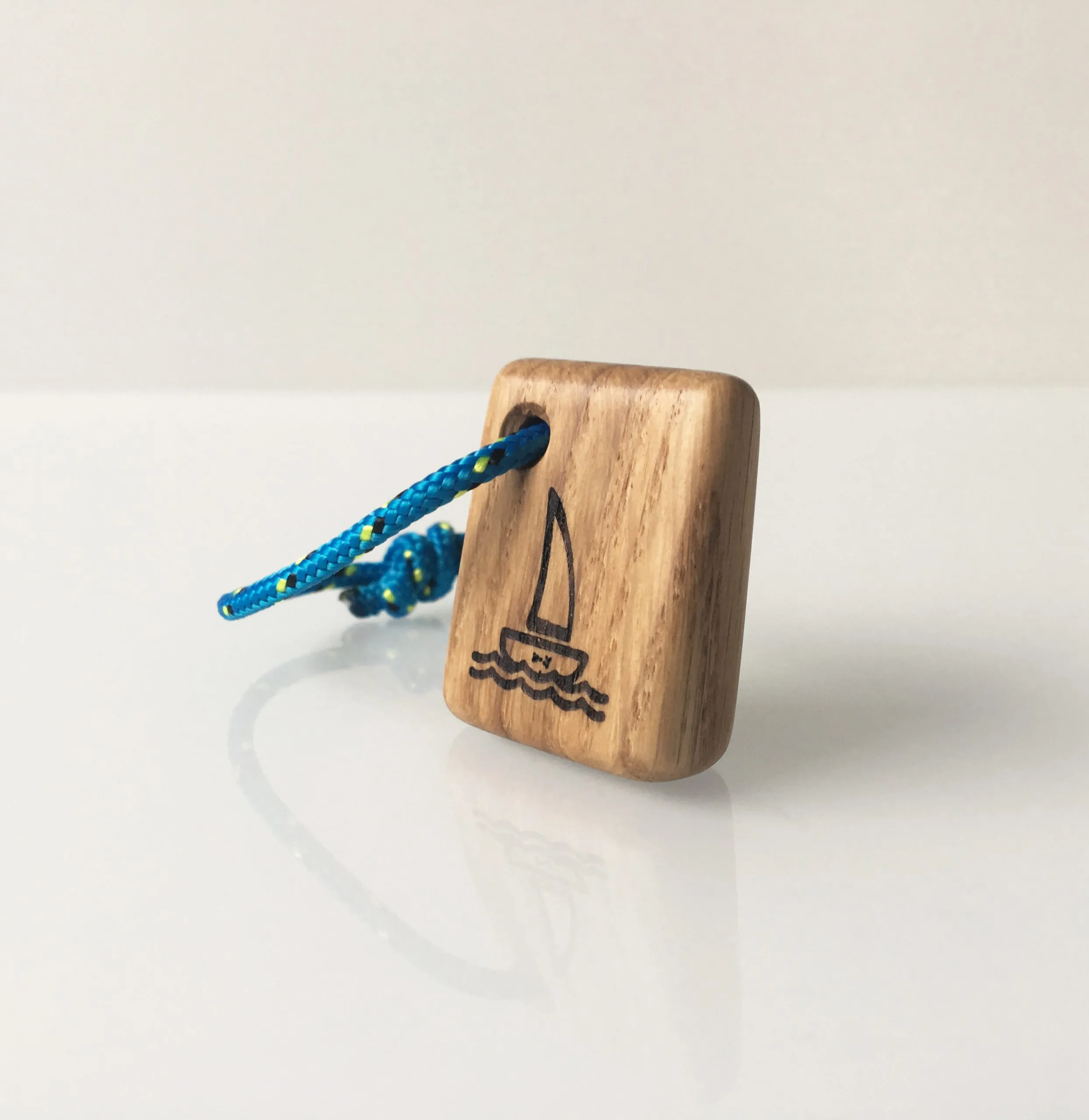 The keychain clipped to a bunch of keys on a boat deck
