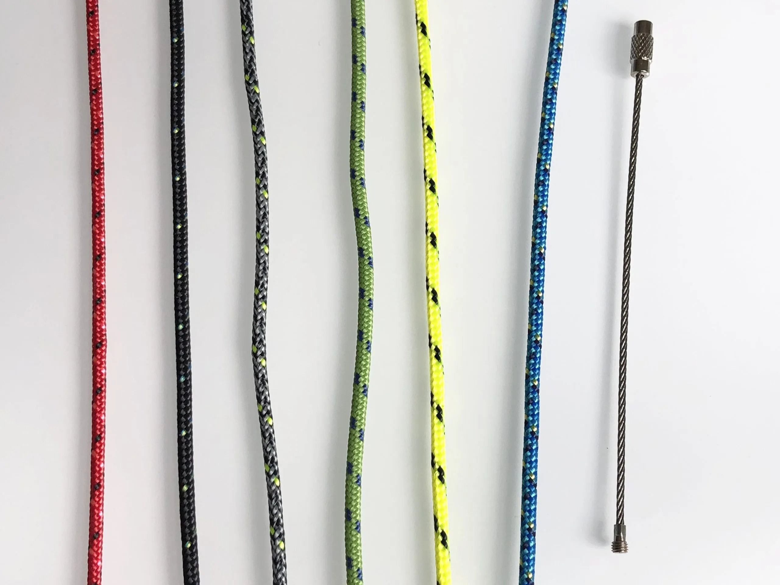 Keychain and coiled rope laid out on linen packaging ready to ship