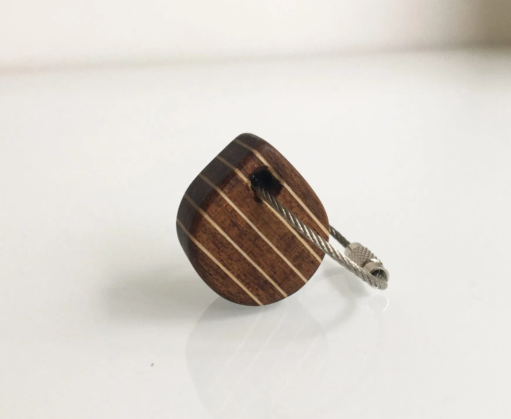 Square keychain with alternating teak and birch strips forming a deck pattern