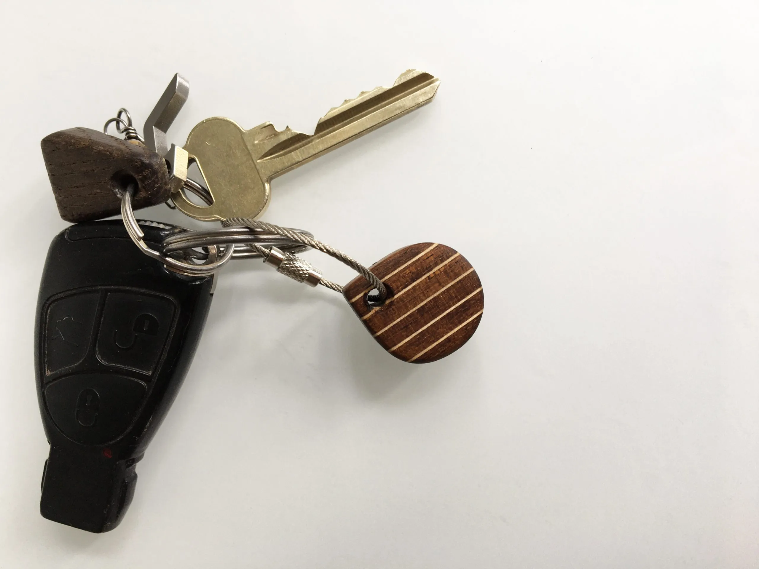 Smooth tung-oiled surface of the keychain catching the light