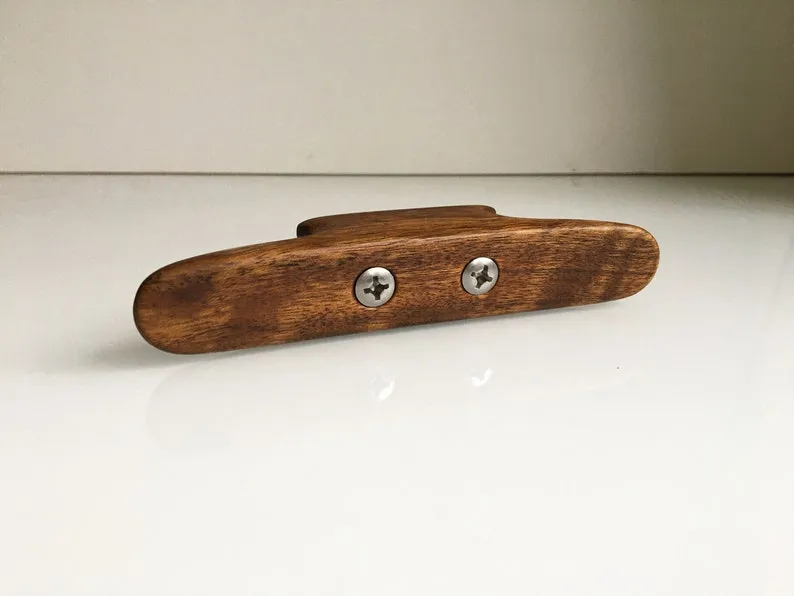 End-on view showing the square section and rounded horns of the cleat