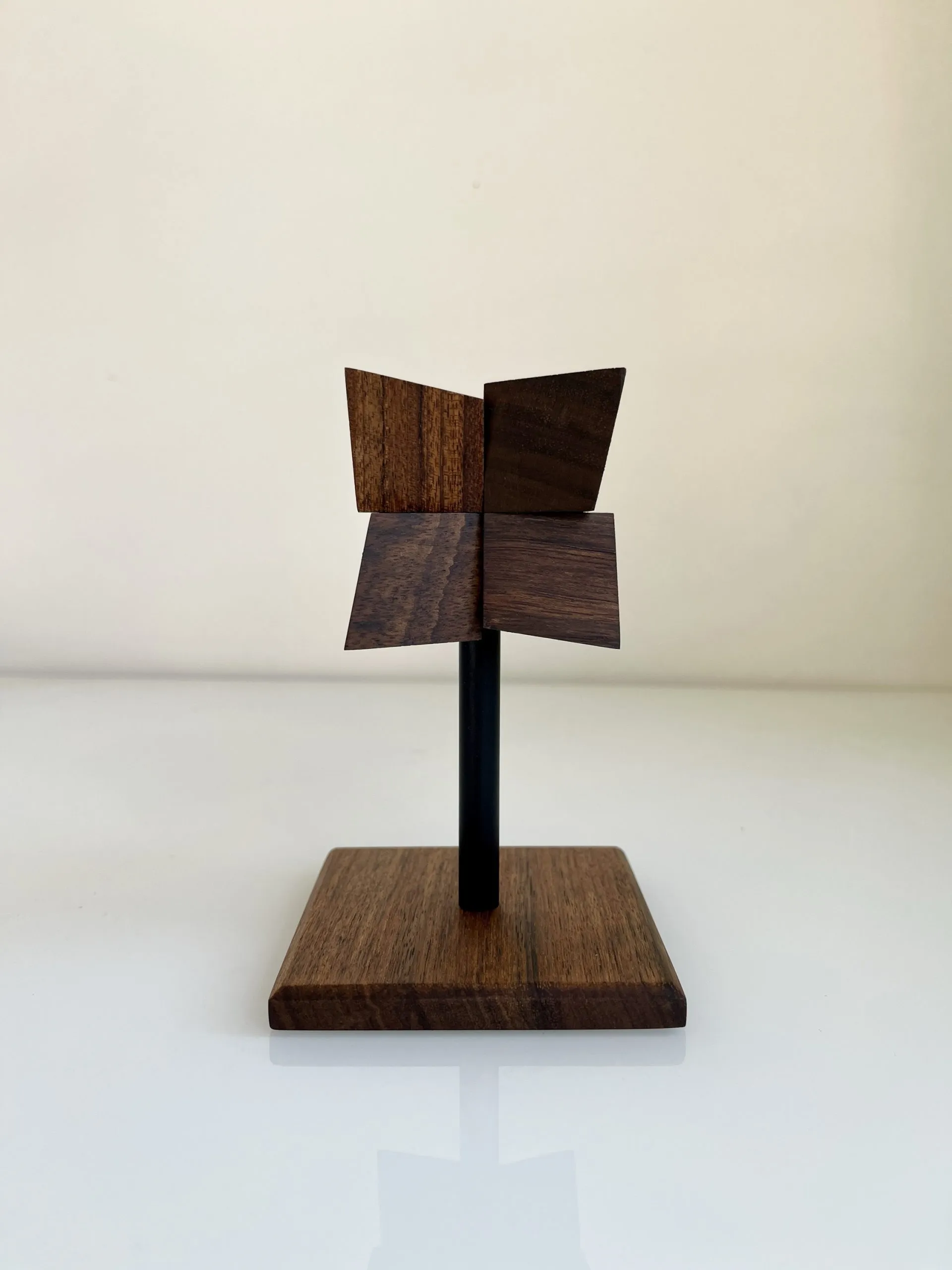 Echinus sculpture on a table, casting a striped shadow