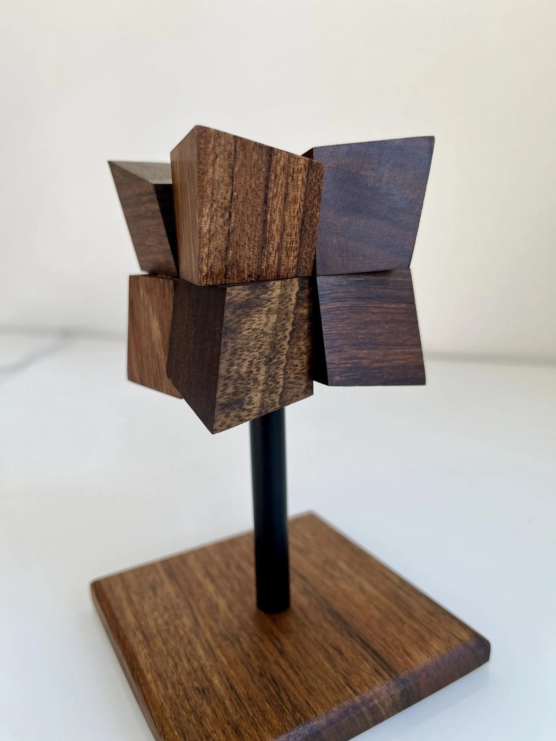 The tapered top of the sculpture seen against a plain background