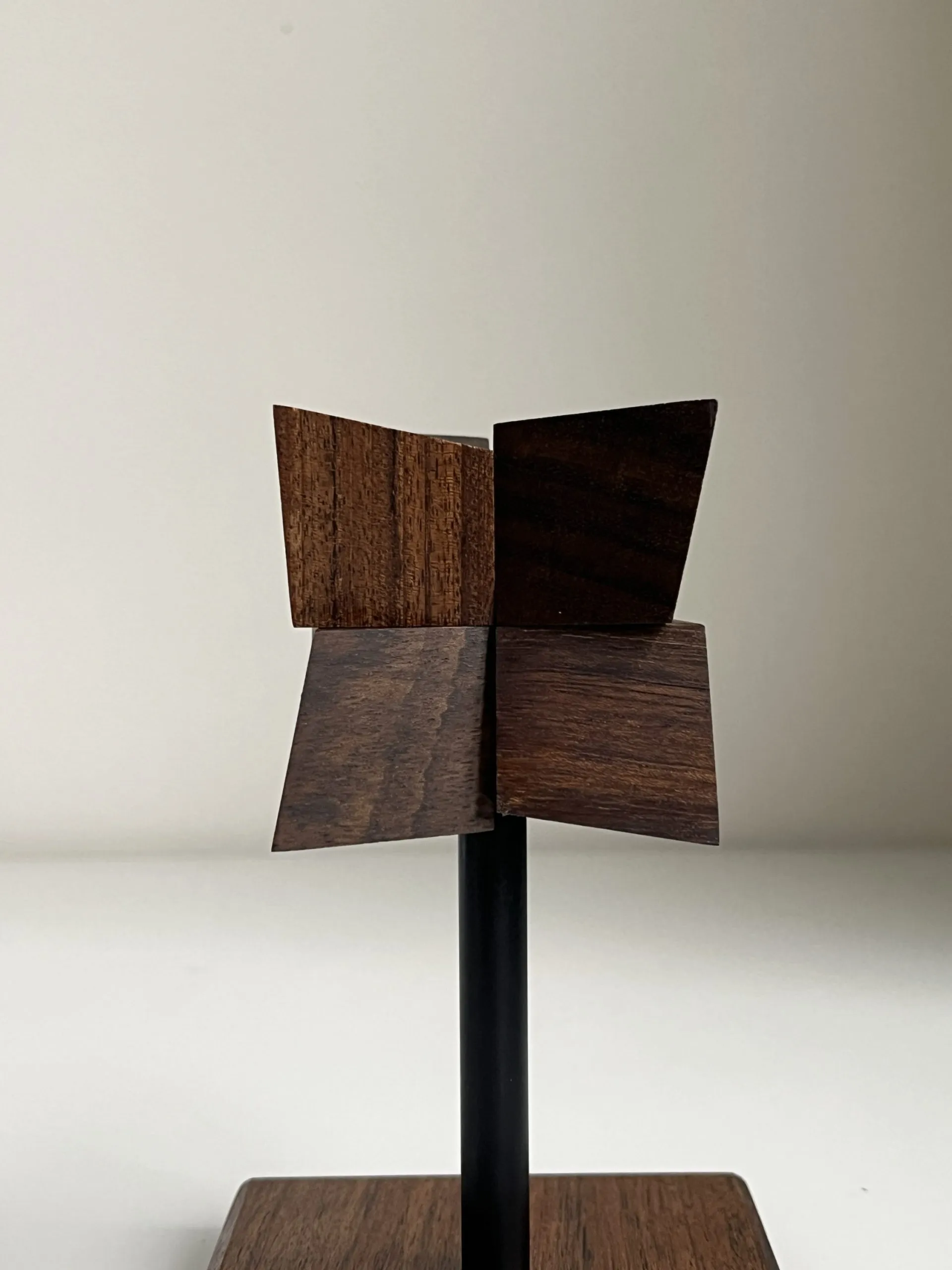 The sculpture beside a hand, standing roughly 22 cm tall